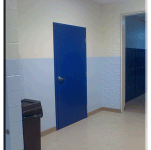 A blue door in a hallway.