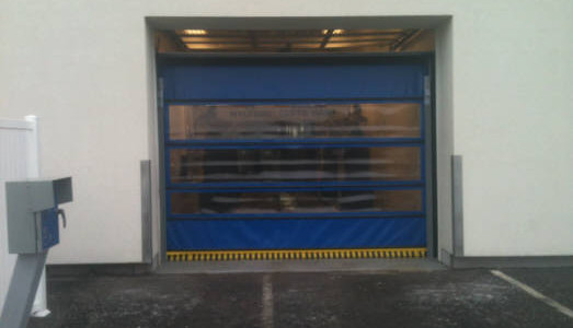 A garage door with a blue door.